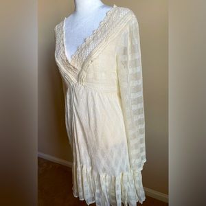 Free People cream-colored lace open back dress.
